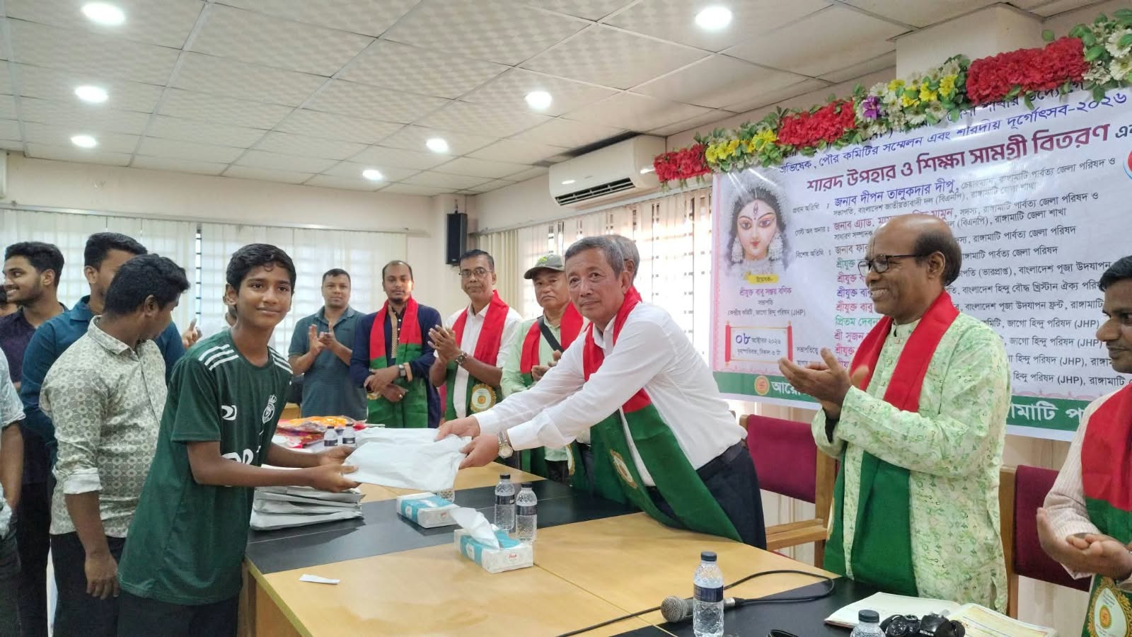 শারদীয় দুর্গাপূজা উপলক্ষে শারদ উপহার ও শিক্ষা সামগ্রী বিতরণ